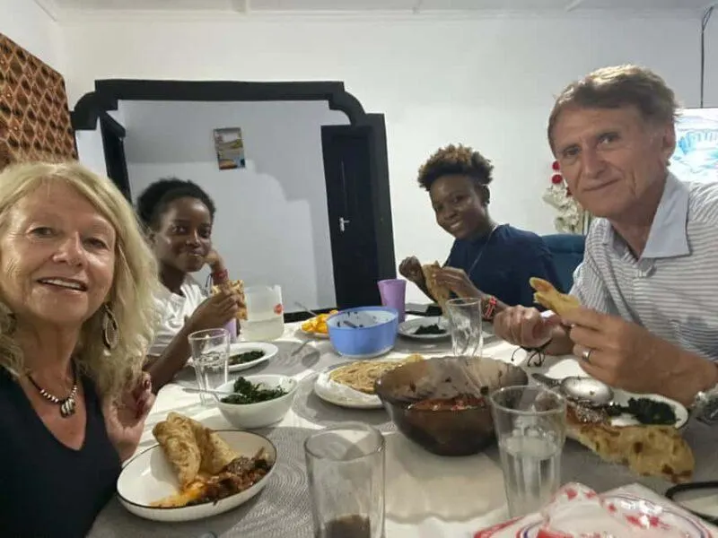Guests enjoying a traditional Swahili meal after a hands-on cooking experience in Diani
