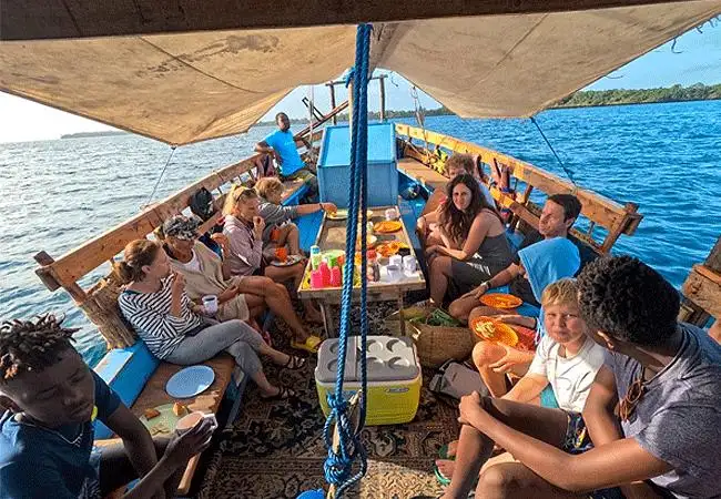 Traditional dhow sailing through Kisite Marine Park near Wasini Island Kenya