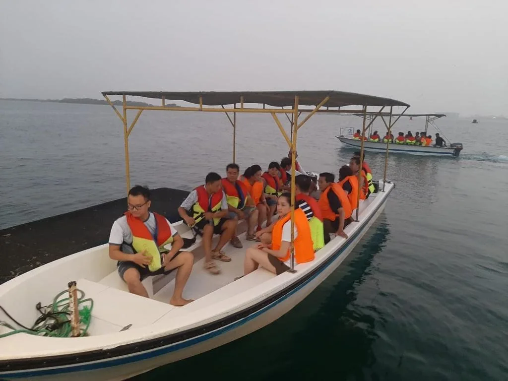 Passengers wearing life jackets during a marine boat excursion on the Kenyan coast