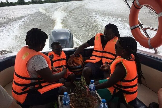 Passengers wearing life jackets during a guided river boat safari in Kenya