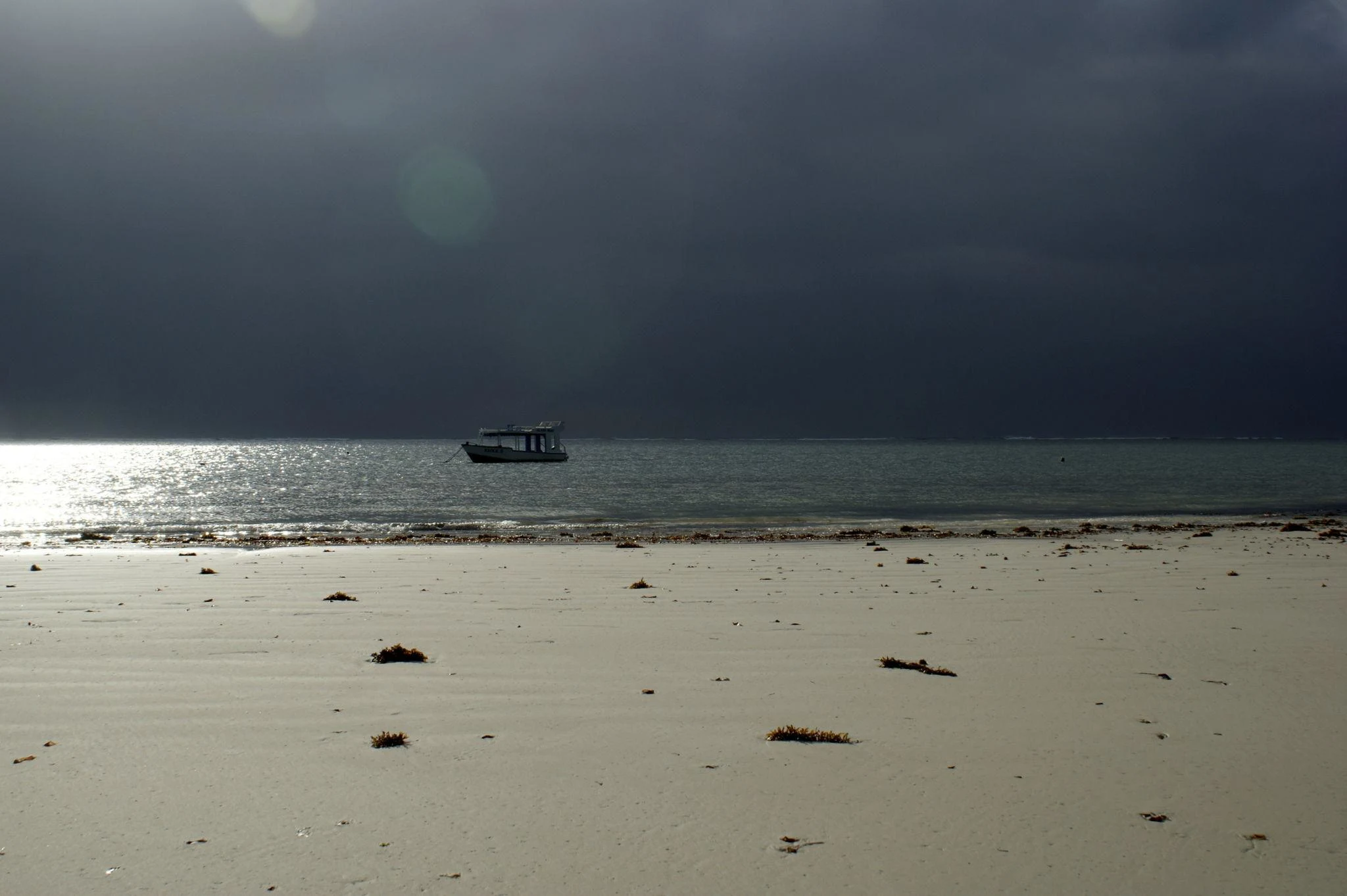 Cloudy tropical weather over the Diani Beach coastline during the rainy season.