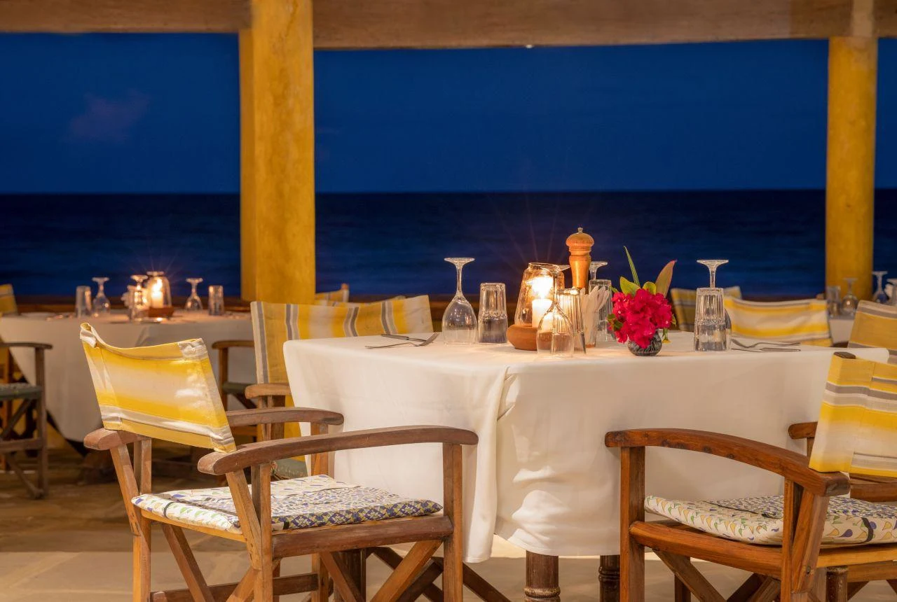 Beach bar in Diani, Kenya, with evening drinks and palm trees near the Indian Ocean